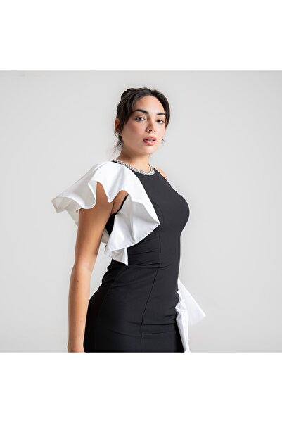 MARIETTAKSA A soft black dress with beading on the neck.