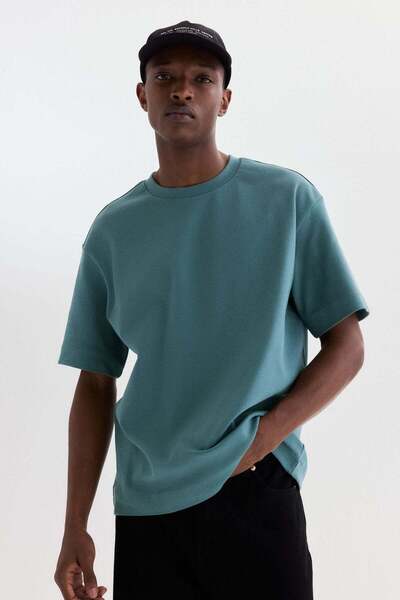 H&M تيشيرت فضفاض بقصة قماش إنترلوك