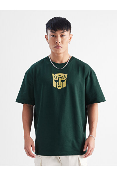 The Souled Store By Styli تيشيرت كبير الحجم بشعار ترانسفورمر باللون الأخضر ال...
