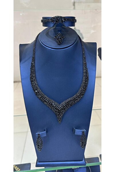 sawaed A set of necklace, earrings, ring, and bracelet made entirely of black...