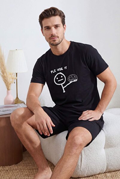 Trendyol Collection Schwarzes Pyjama-Set aus Baumwolle mit lustigem Textdruck...