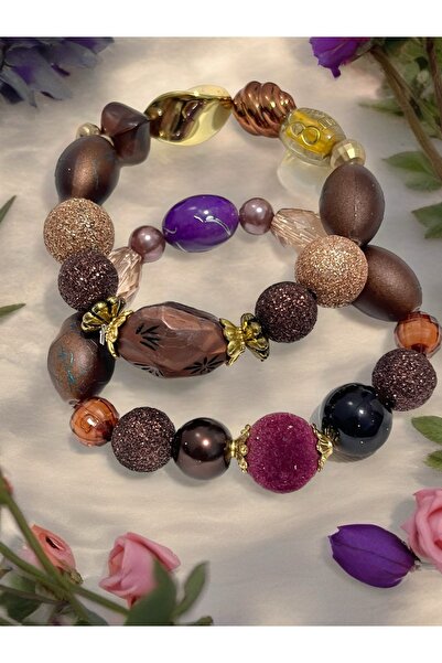 COCOSH TAKI Brown, purple, and gold-detailed two-tone stretch bracelet.