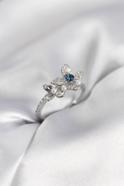 Inure Jewelry خاتم نسائي فضي اللون مزين بحجر الزركون على شكل زهرة