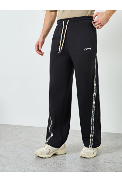 Styli Men Black Side Taping Print Oversized Joggers