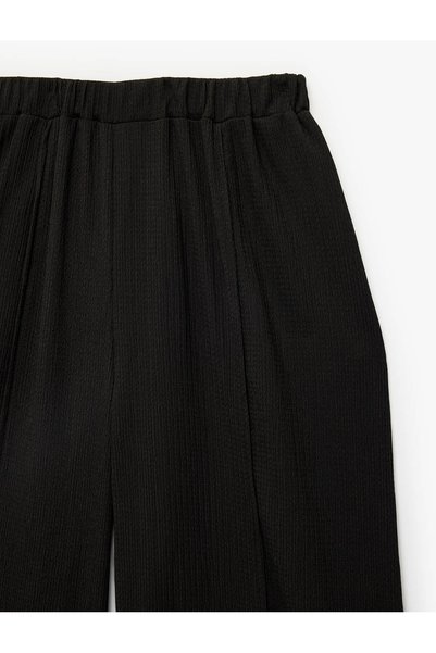 Koton Beli Lastikli Yırtmaç Detaylı Dokulu Geniş Paça Pantolon