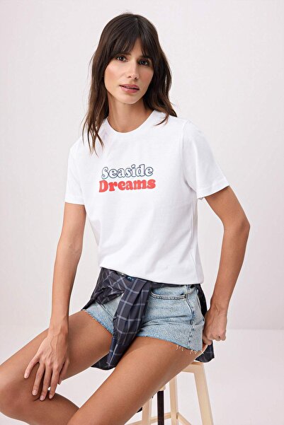 ترينديول كوليكشن تي شيرت إكرو سولوجان ذو تصميم عادي/عادي بأكمام قصيرة 100% قط...