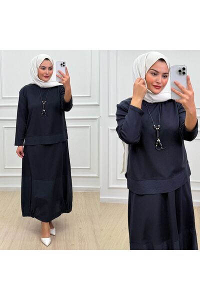 QUAWEAR طقم من قطعتين من القماش المحبوك بياقة دائرية وتنورة مزمومة من الجانبي...