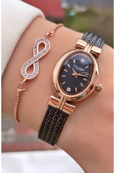 Tom Jones ساعة يد نسائية بسوار فولاذي باللون الأسود الوردي - سوار