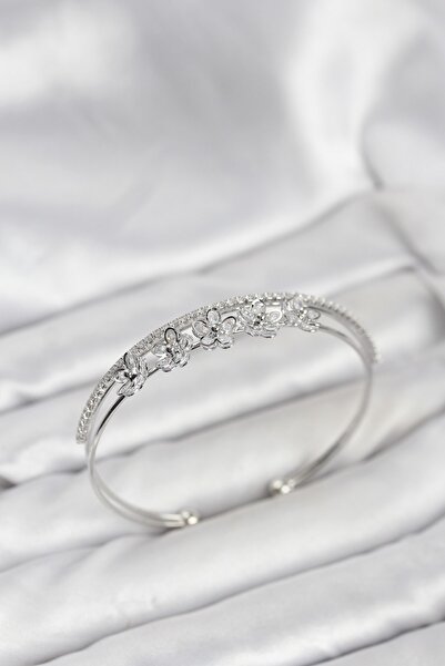 Inure Jewelry سوار نسائي موديل زهرة بلون نحاسي فضي