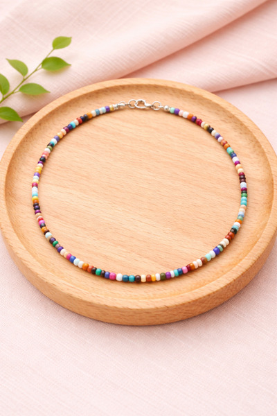 Crystal Atelier قلادة من الخرز الرملي باللون الأصفر للنساء