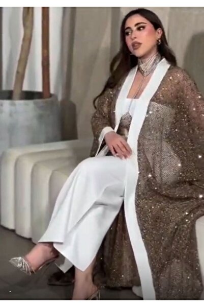 NALA FASHION The Dress Combines the Serenity of Its Basic Color with the Eleg...