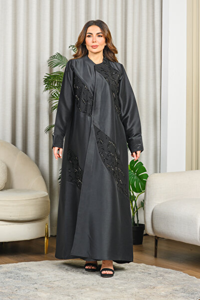 Nasnasa Abayat Luxurious taffeta abaya with floral trim and delicate hand-bea...