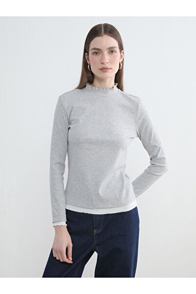 LC Waikiki بدلة نسائية من Özmarka للموسم الجديد بياقة عالية وتفاصيل مكشكشة