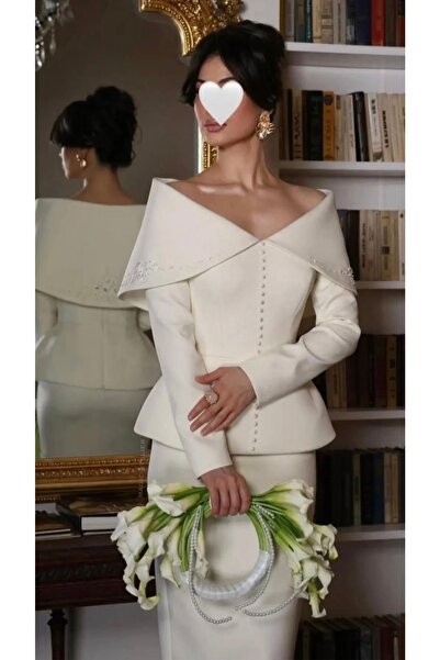 revan Boutique A luxurious white off-shoulder set with pearl details