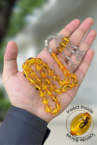 NAMAT سبحة رجالية من الكهرمان المسحوق بقطع دائري مع نملة داخلية وشرابة حصرية.