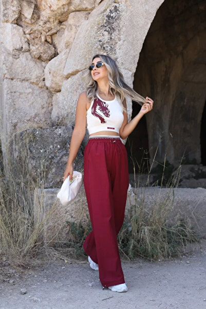 bytugcekaya طقم بلوزة وبنطلون باراشوت بلون بوردو مع طباعة النمر