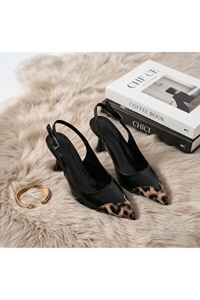 KM shoes Topuklu leopar, siyahın zamansız şıklığıyla buluşuyor: Cesur Adımlar...
