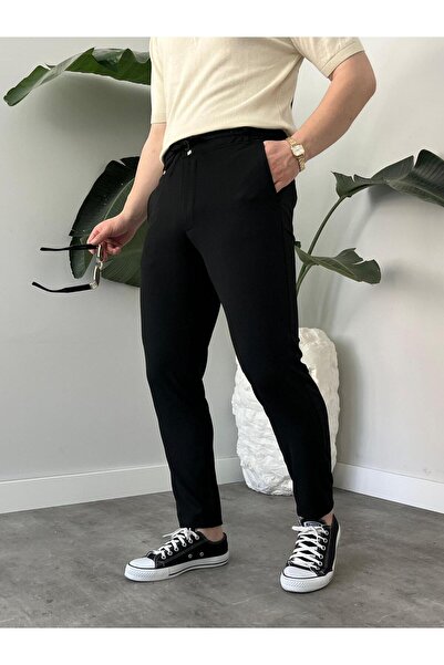 Ser Joven بنطلون رجالي أسود مريح بخصر مطاطي وأربطة وجيوب جانبية من قماش الجوجر