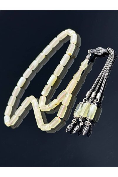 Tasarım الكهرمان الجليدي |   حجر العنبر الطبيعي مع شراشيب فضية