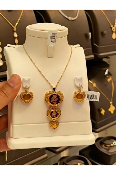 SAMGE An elegant gold heart-shaped floral jewelry set—a necklace and earrings...