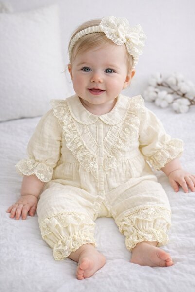 Pure Boutique Βρεφικό ολόσωμο φορμάκι από μουσλίνα σε χρώμα ιβουάρ με κομψή δ...