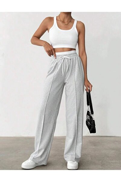 Eşofmancım Αθλητικό παντελόνι γυναικείο με φαρδιά μπατζάκια και κουμπιά.