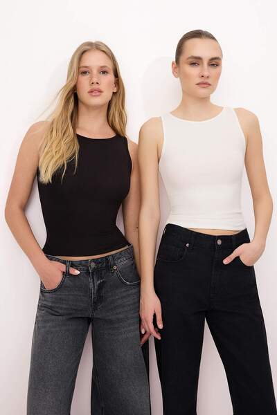 Trendyol Collection قميص داخلي محبوك ومرن بدون أكمام ذو ياقة مستديرة وقصة ضيق...