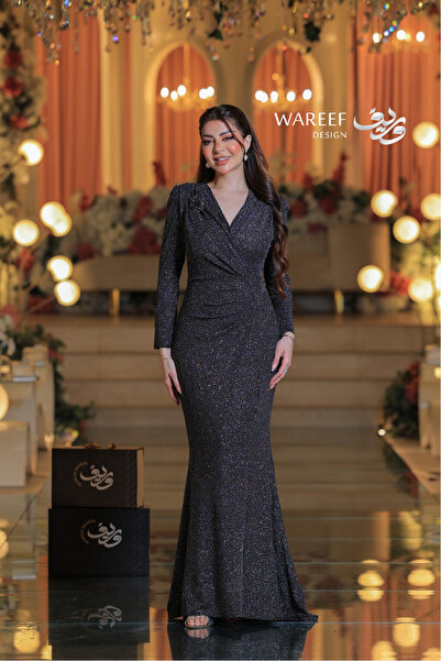 WAREEF FASHION A sparkly evening dress with a modern design and long sleeves.