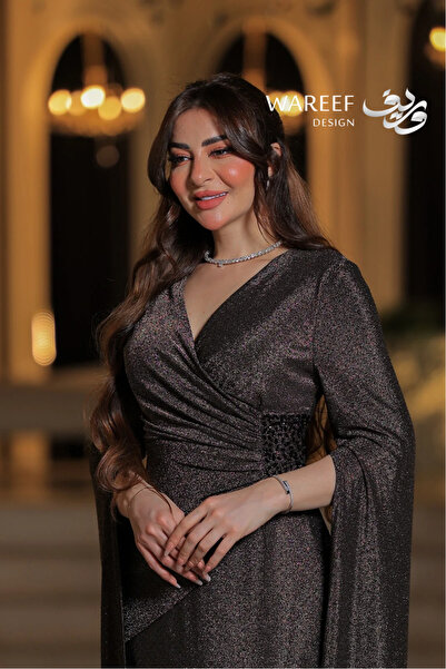 WAREEF FASHION Dark gold off-shoulder evening dress with long sleeves and a c...