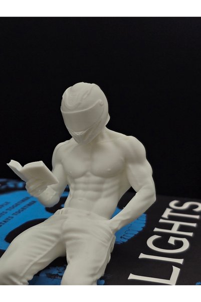 The Plasti Motorcyclist Reading a Book Bookshelf Decor