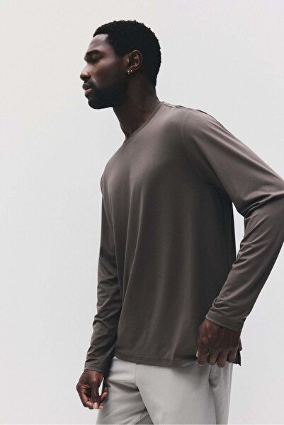 H&M قميص رياضي بأكمام طويلة مع DryMove™
