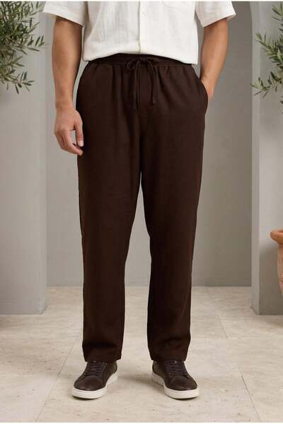 Valiberta بنطلون رياضي رجالي من قماش أوديسا بقصة فضفاضة من Prawer - بني