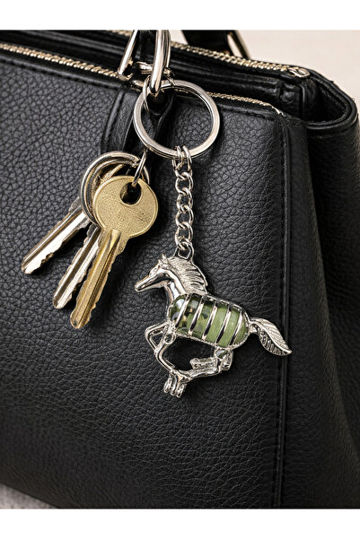 HER ŞEY NOTA www.herseynota.com Glow-In-The-Dark Zebra Figured Metal Keychain...