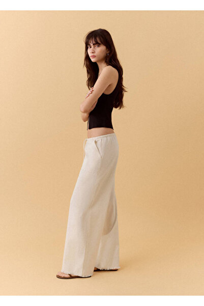 Mango Teen Zımbalı dökümlü pantolon