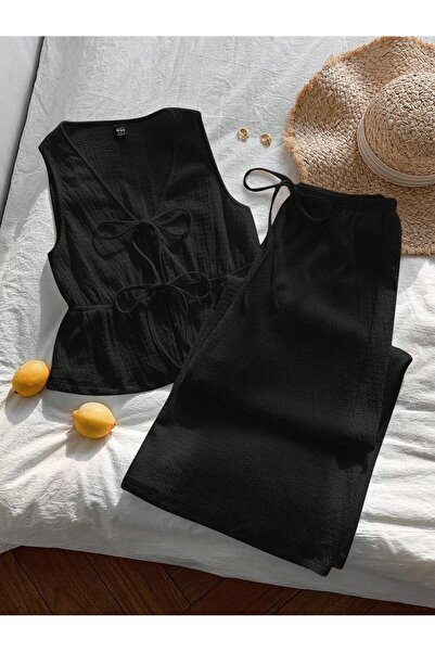 WEEST MODA siyah yelek iki önden bağlama detaklı crop geniş paça pantolon alt...