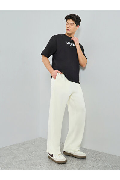 Styli Men Oversized Pants with Pocket Badge
