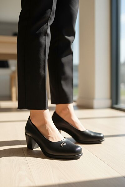 enoch Women's Black Textured Leather Classic Shoes with Metal Logo on the Sid...