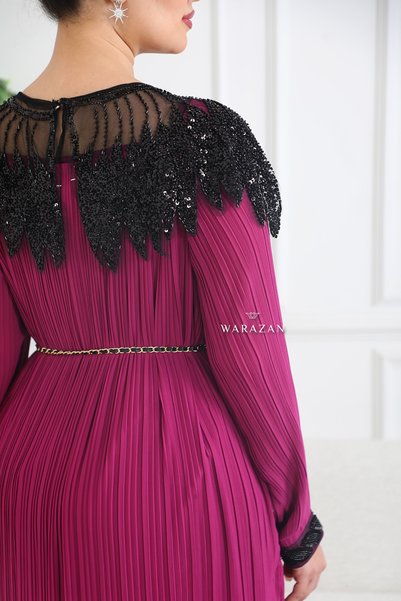 Bravo A royal dress with sequins on the bodice, a rose at the waist, and a belt.