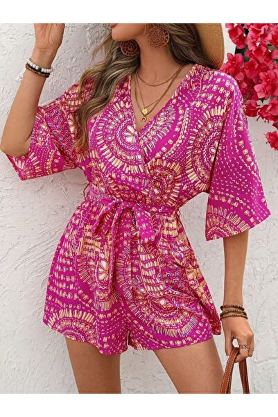 MODA Trend kısa kollu belden kuşaklı kruvaze yaka desenli kısa kadın tulum