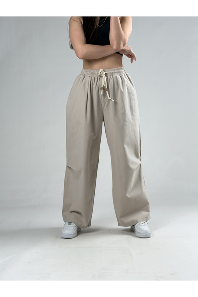 COCOPELLI Γυναικείο φαρδύ παντελόνι σε μπεζ χρώμα με λεπτομέρεια στο γόνατο C...