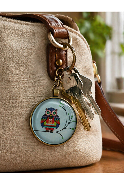 HER ŞEY NOTA www.herseynota.com Μεταλλικό μπρελόκ με μοτίβο κουκουβάγιας Unis...