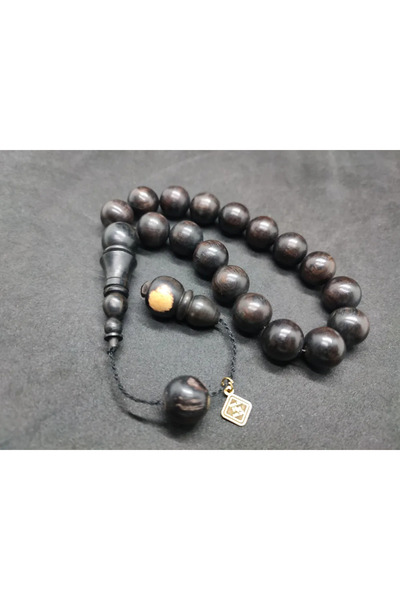 İskeçe Tesbih Τεχνούργημα του δασκάλου Χαλίλ Χιλμί: Μασκότ από ξύλο έβενου