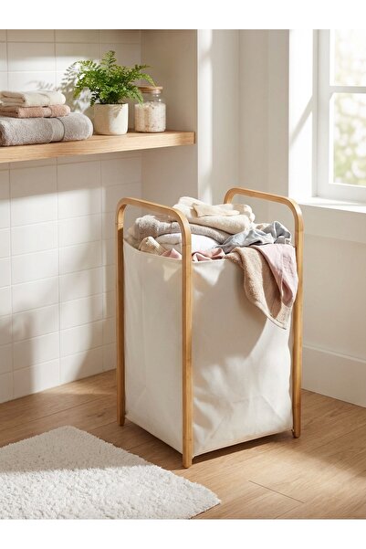 The Living Fabric laundry basket with a foldable wooden frame.