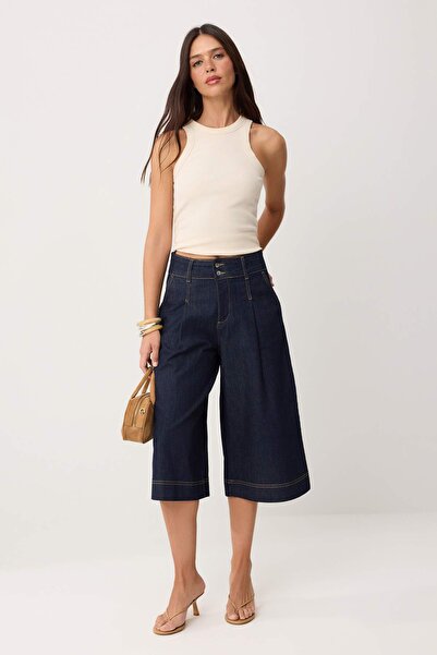 Συλλογή Trendyol Σκούρο μπλε ψηλόμεσο τζιν κάπρι με φαρδιά μπατζάκια TWOSS26J...