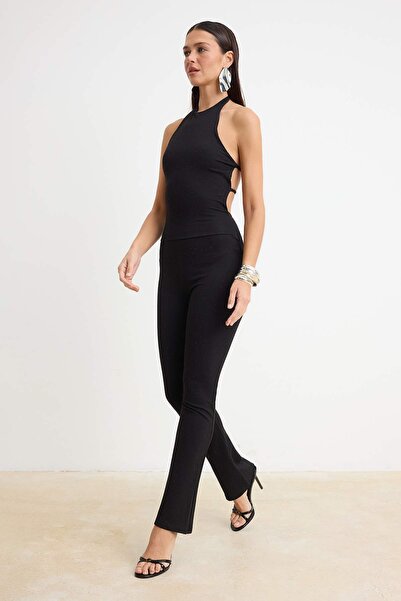 Συλλογή Trendyol Μαύρη Πλεκτή Ολόσωμη Φόρμα με Λαιμόκοψη Halter και Αμάνικο Σ...