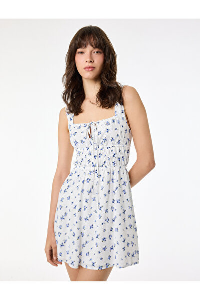 Koton Αμάνικο μίνι φλοράλ φόρεμα με δετό γιακά και λεπτομέρεια παραθύρου στην...