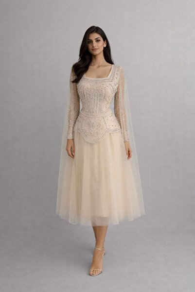 molan fashion "إبداع يجسد الأناقة: فستان الشيفون المطرز باللؤلؤ والشك الدقيق."