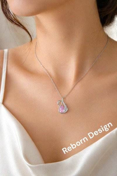 REBORN DESIGN سلسلة فولاذية 316L فضية اللون على شكل طائر البجعة الوردي