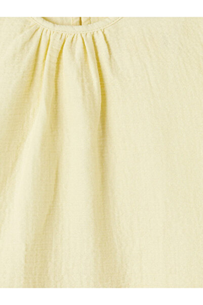 LC Waikiki Κίτρινη μπλούζα μουσελίνας για κορίτσια με βολάν και λαιμόκοψη ποδ...