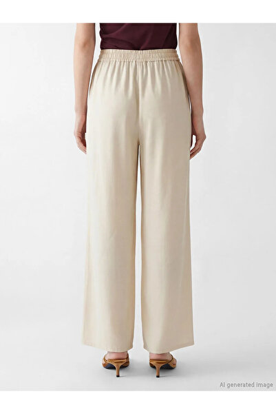 LC Waikiki Μπεζ γυναικείο τζιν παντελόνι με ελαστική μέση και φαρδιά μπατζάκια